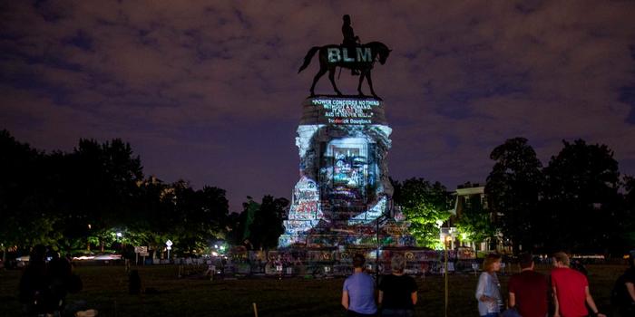 How a Summer of Protests Is Changing the Ways We Commemorate U.S. History, Including the Fourth of July Frederick Douglass’ image is projected on the Robert E. Lee Monument