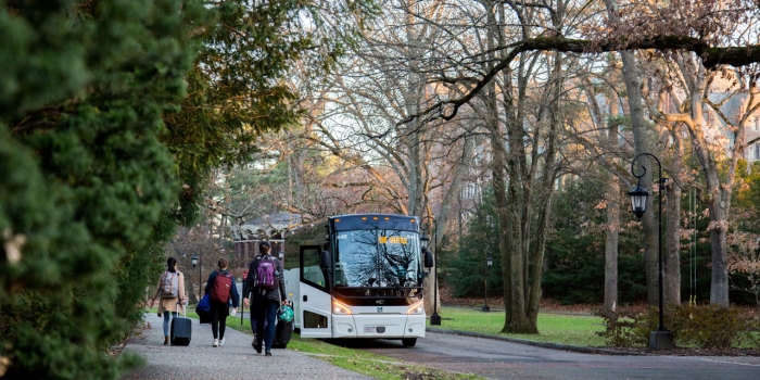 Happy Thanksgiving from Wellesley! Students walk to a bus outside the chapel, bound for Boston.