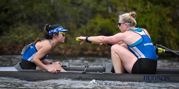PERA Reached New Heights in Programming and on the Podium This Fall A coxswain and rower sit facing each other in a boat during a race.