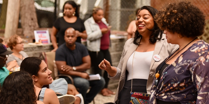 Wellesley Alumnae Across Generations Have Worked for Equal Representation for Women Liz Miranda '02 talks to constituents at a campaign event. (2018)