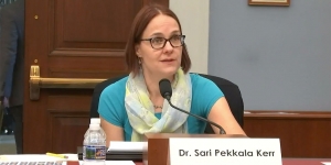 Wellesley Researcher Testifies Before Congress on the Economic Benefits of Immigration A woman sits at a table with a microphone.