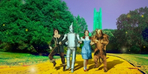 Wellesley’s Davis Museum Opens Summer Film Series June 28 with The Wizard of Oz Characters from the Wizard of Oz stand on the yellow brick road in front of emerald green Galen Stone Tower.