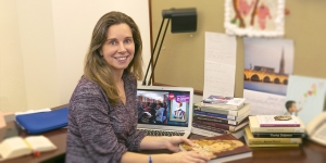 France’s First Modern Novel Gets Its First Digital Bilingual Edition Helene Bilis sits at her desk in the Newhouse Center