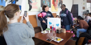 Wellentine’s Day, a Celebration of Wellesley Students and Their Communities Two Wellesley students record an interview with a Snapchat Reporter on a iPhone in the LuLu Dining Hall.