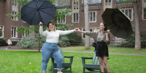 5 New Things We’re Excited About at Wellesley Two students stand by Adirondack chairs in the academic quad.