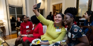 Wellesley Honors Seniors Who Have Completed Classes in December Students sit in the president's house, taking a selfie