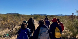 Wellesley Students Bring Home Ideas for Change after Wintersession Civil Rights and Immigration Trips Students walk through a desert in Arizona.
