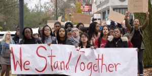 Wellesley and Babson Students Join Forces to Stand Against Hate Students march with a We Stand Together banner