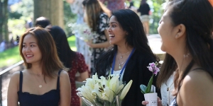 Wellesley Celebrates 144th Flower Sunday students smiling and holding flowers