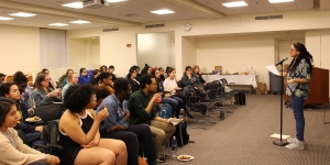 Wellesley Celebrates Latinx Month 2018 Poet Ariana Brown recites poetry before a crowd.