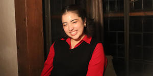 Senior Snapshot, Lizette Ortega ’22: “I want people to find their community in physics” Lizette Ortega wears a long-sleeved red shirt and black sweater vest. She smiles at the camera.