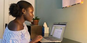 Mochi, a New Chatbot Life Coach, Aims to Help Users Maintain Well-being and Productivity During the Pandemic Adhel Geng ’22 working on a laptop