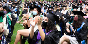 98 Percent of Wellesley’s 2021 Graduates Were in Jobs, Grad School, the Military, or Service within Six Months Students seated in the audience during commencement, applauding.