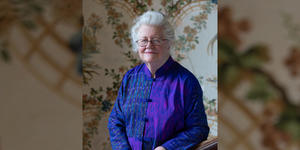 Acclaimed WCW Researcher Peggy McIntosh to be Inducted into the National Women’s Hall of Fame Peggy McIntosh on Cheever House’s grand staircase with original wallpaper and bannister dating from 1894.