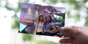 Dear Wellesley: Rebecca Arango ’21 and Renee Chen ’21 Send Greetings from Chicago Two students in a postcard standing in front of a skeleton dinosaur.