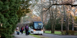 Happy Thanksgiving from Wellesley! Students walk to a bus outside the chapel, bound for Boston.