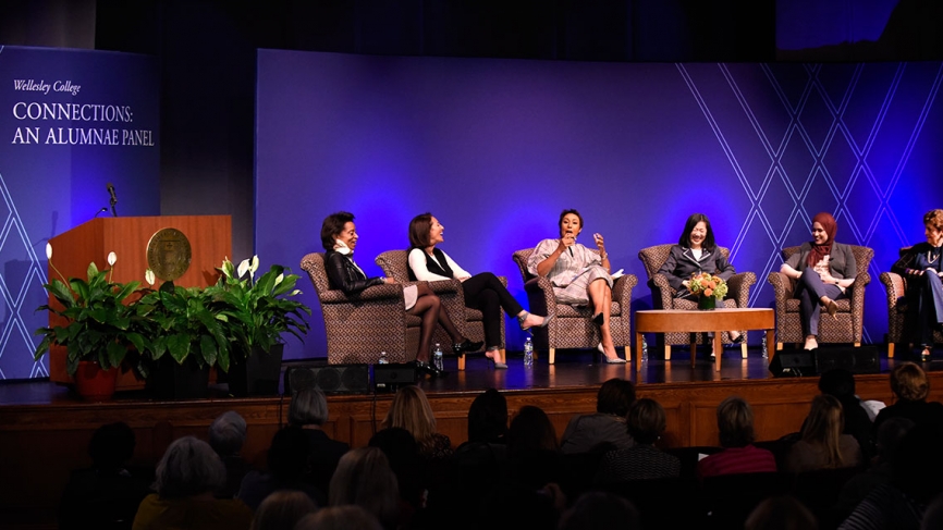 alumnae panelists on stage