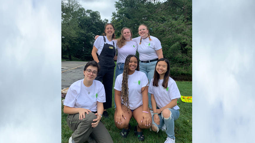 a group of people posing and smiling