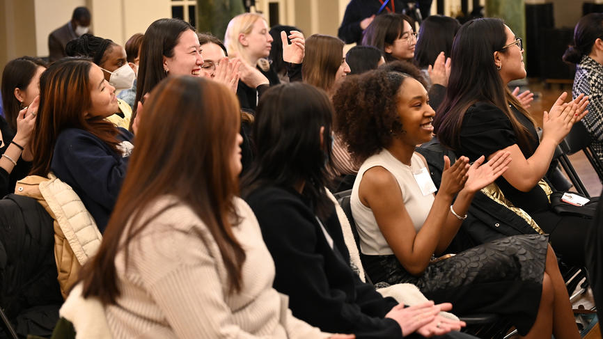 Graduates applaud during the December Finishers event.