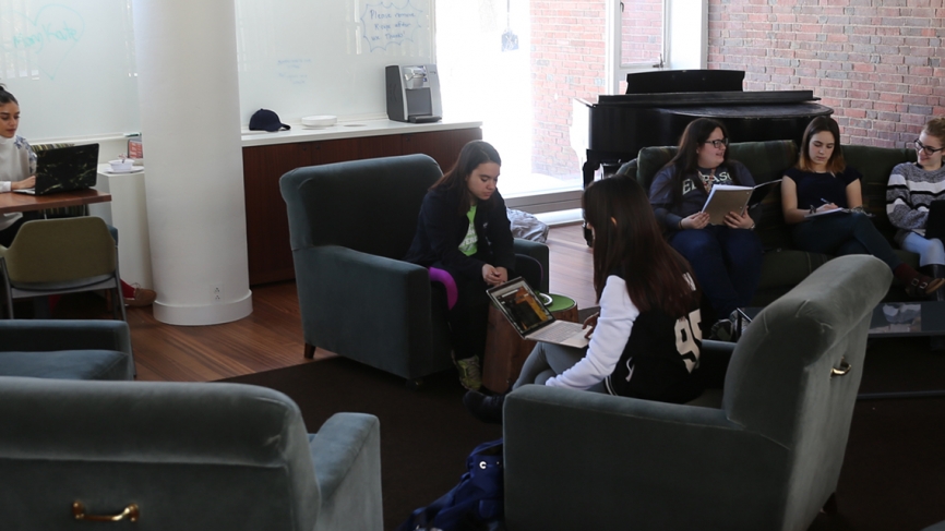 Farther east, past the Science Center, students gather at lunchtime in the renovated Freeman living room.