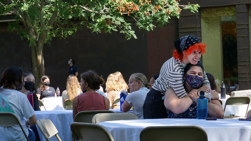 students hugging