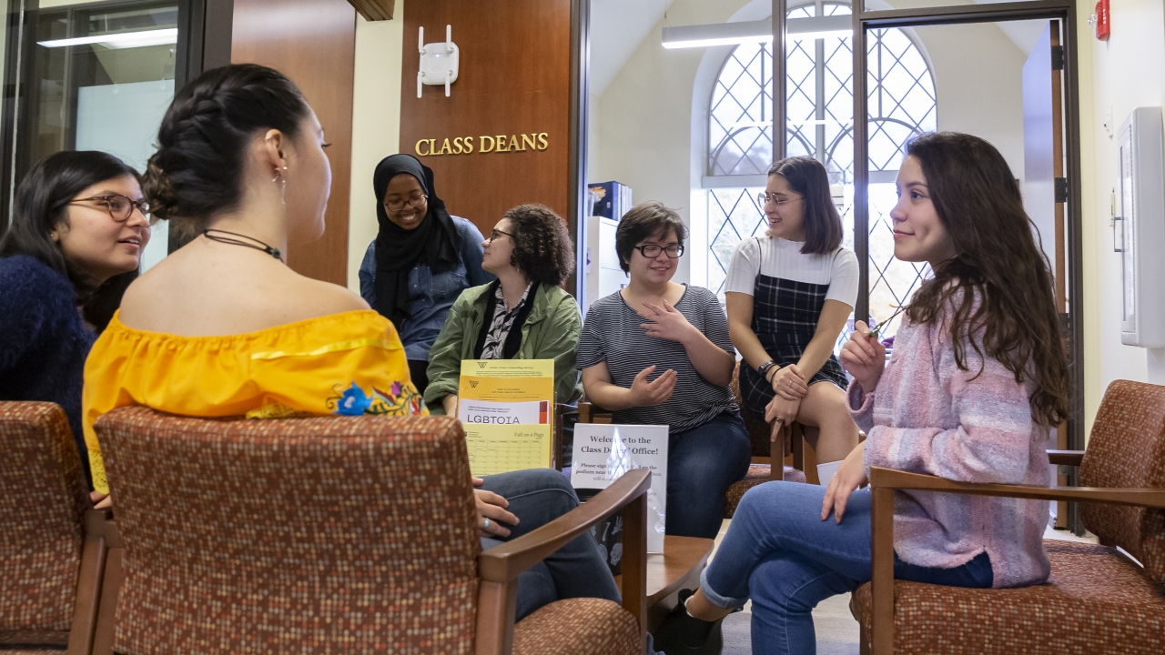 students talking outside of Rebecca Garcia's office, located on the second floor of Schneider.