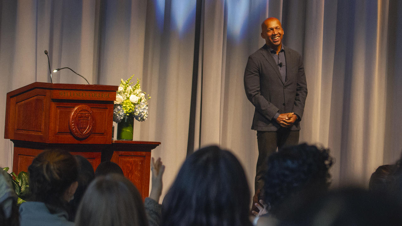 Civil Rights Lawyer Bryan Stevenson smiles while receiving a standing ovation.