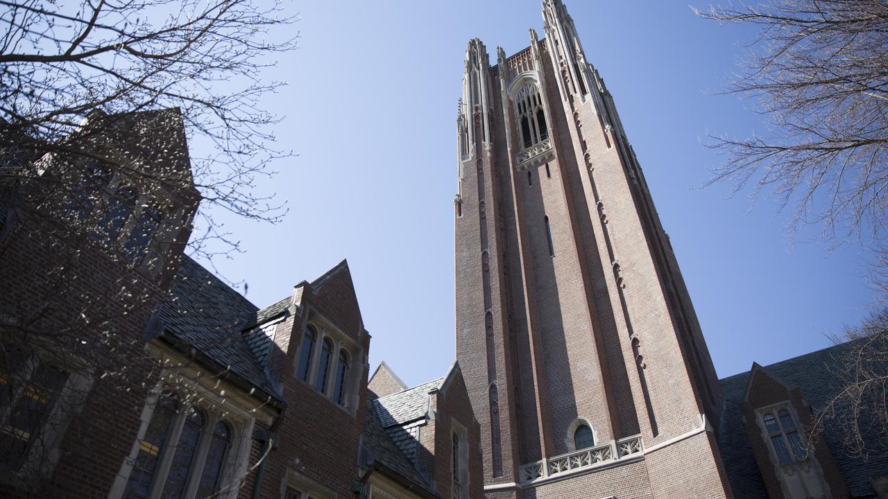 Wellesley College's Galen Stone Tower and Green Hall against a blue sky