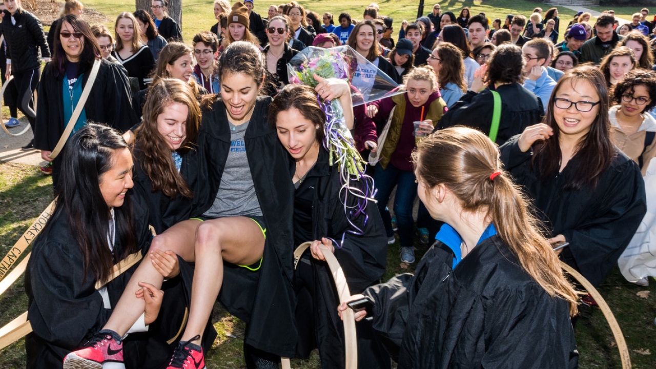 Emily Hamilton is carried by classmates after winning the 2018 Hooprolling competition.