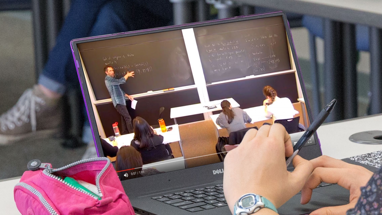 Student watches class on her laptop