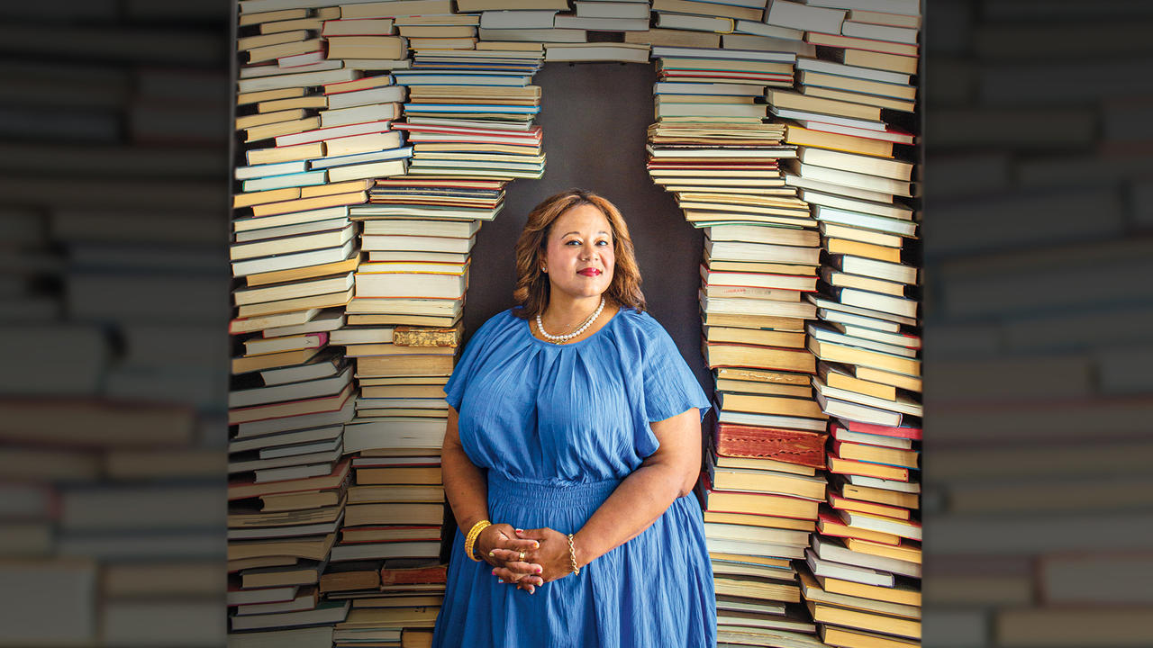 Jasmine Guillory ’97 photographed in front of stacks of books.