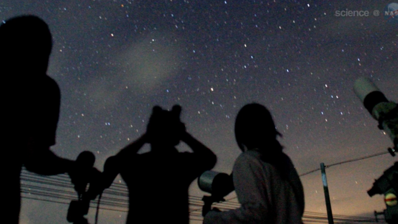 Star gazers watch the night sky during a meteor shower.