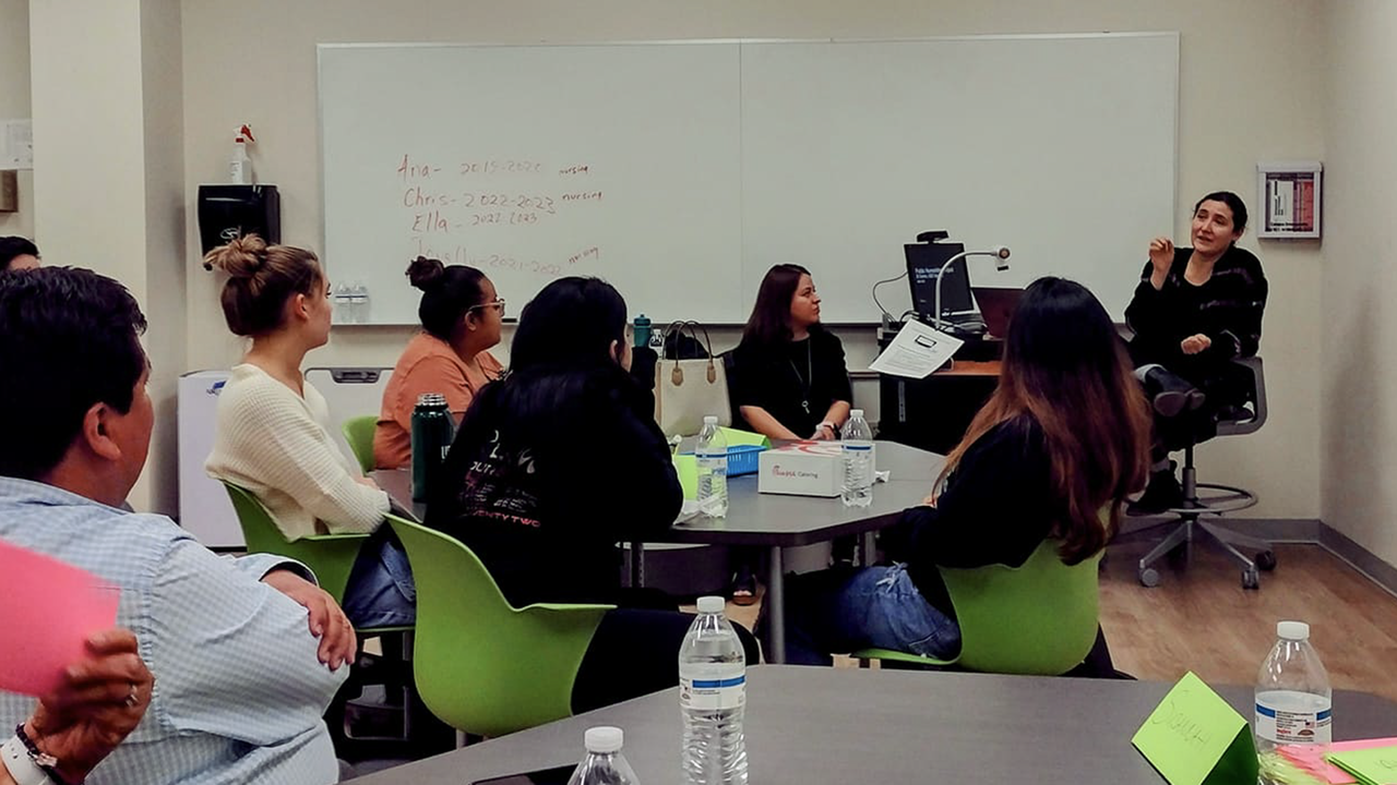 Professor Kathya Landeros speaks to students.