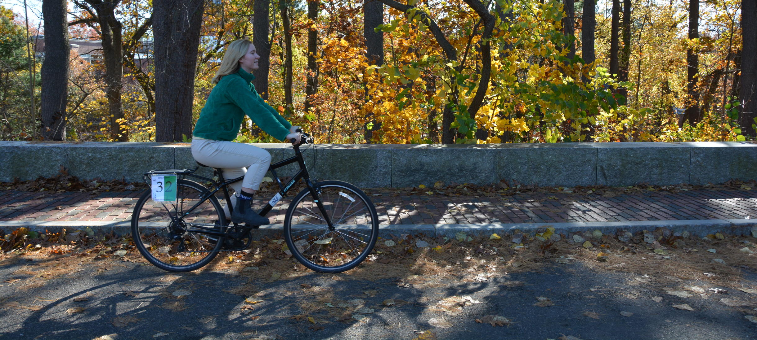 Student riding a bike share bike that was purchased through the Green Fund.